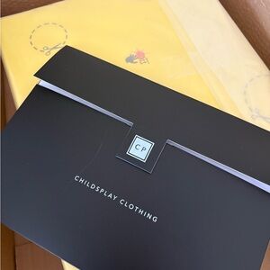 Childsplay Clothing Black and Yellow Packaging